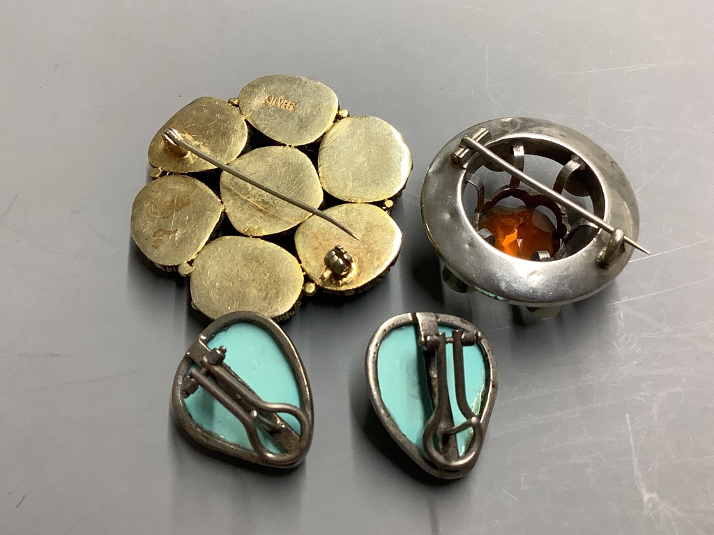 A circular silver gilt and seven-stone turquoise brooch, a pair of silver-mounted clip earrings and a Scottish silver and cairngorm kilt pin